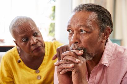 Woman comforting a depressed man