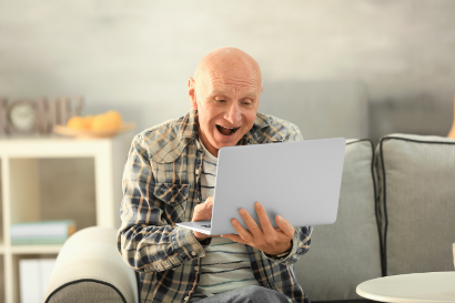 Senior man with laptop