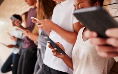 People standing around on their mobile phones