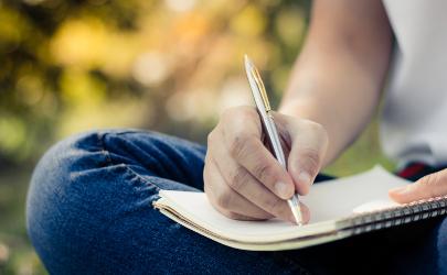 Person writing in a notebook
