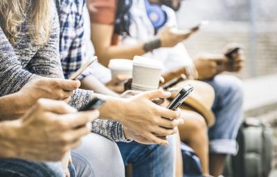Group of people using smartphones