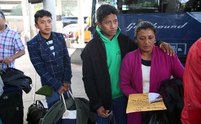 Migrant mother with two teenage sons