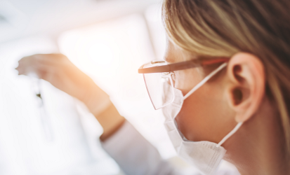 Female scientist wearing a face mask